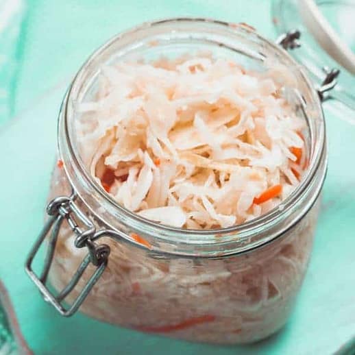sauerkraut in a glass jar on the table